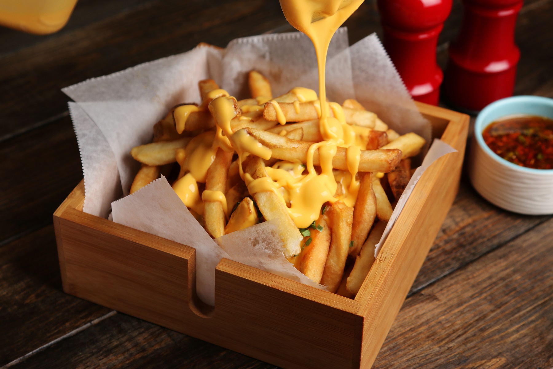 French,Fries,With,Melted,Cheddar,Cheese,On,Top